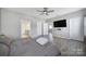 Bright bedroom boasts a modern ceiling fan, wood-look flooring, and multiple doorways at 4631 Christina Ct, Gastonia, NC 28056
