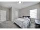 Neutral bedroom featuring carpet, bright window, and ensuite bathroom at 4631 Christina Ct, Gastonia, NC 28056
