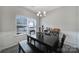 Bright dining area with large window and dark wood furniture, perfect for entertaining or Gathering meals at 4631 Christina Ct, Gastonia, NC 28056