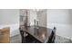 Cozy dining area with dark wood table and easy access to the kitchen, creating a warm and inviting atmosphere at 4631 Christina Ct, Gastonia, NC 28056
