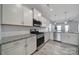 Well-equipped kitchen featuring stainless steel appliances, granite countertops, and a bright, functional layout at 4631 Christina Ct, Gastonia, NC 28056