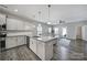 Open-concept kitchen with granite countertops, stainless steel appliances, and seamless flow into the living area at 4631 Christina Ct, Gastonia, NC 28056