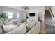 Spacious living room boasts wood-look floors, a modern ceiling fan, and a cozy seating area at 4631 Christina Ct, Gastonia, NC 28056