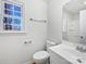 This cozy bathroom has a window, toilet, sink, towel bar and lighting at 5012 Maplecrest Dr, Gastonia, NC 28056