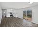 Bright eat-in kitchen with white cabinets, stainless steel appliances, and deck access at 5012 Maplecrest Dr, Gastonia, NC 28056