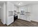 Clean kitchen featuring white cabinets, countertop space and black oven at 5012 Maplecrest Dr, Gastonia, NC 28056