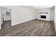 Spacious living room with hardwood floors and a white brick fireplace at 5012 Maplecrest Dr, Gastonia, NC 28056