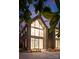 Modern home featuring a two-story wall of windows and striking architectural details at 5500 Carmel Rd # 101, Charlotte, NC 28226