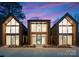 New modern home featuring unique architectural design, large windows, and pristine curb appeal at 5500 Carmel Rd # 101, Charlotte, NC 28226