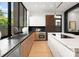 Well-lit kitchen features modern cabinetry, stainless steel appliances, and a sleek design for cooking and entertaining at 5500 Carmel Rd # 101, Charlotte, NC 28226