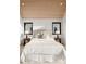 Calm bedroom with whitewashed ceiling, plush bedding, and views from the windows at 5500 Carmel Rd # 103, Charlotte, NC 28226