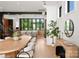 Open concept dining area features contemporary decor, stylish seating, and natural lighting at 5500 Carmel Rd # 103, Charlotte, NC 28226