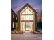 Striking modern home with soaring windows, unique architecture, and inviting entrance at 5500 Carmel Rd # 103, Charlotte, NC 28226
