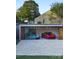 Modern garage featuring a sliding glass door and a collection of high-end sports cars parked inside at 5500 Carmel Rd # 103, Charlotte, NC 28226