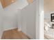 Hallway leading to bedroom with minimalist trim, wall-to-wall baseboard, and wood ceiling at 5500 Carmel Rd # 103, Charlotte, NC 28226