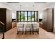 Modern kitchen with a large island, counter seating, floor to ceiling cabinets and a window overlooking the backyard at 5500 Carmel Rd # 103, Charlotte, NC 28226