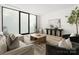 Bright living room with stylish furnishings, large windows, and minimalist design at 5500 Carmel Rd # 103, Charlotte, NC 28226