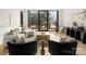 Spacious living room filled with natural light from large windows and minimalist design at 5500 Carmel Rd # 103, Charlotte, NC 28226