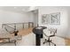 Second floor office featuring a modern desk and chair and a seating area with a view of the railing at 5500 Carmel Rd # 103, Charlotte, NC 28226
