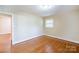 Bathroom featuring a sink, toilet, and tile walls at 5536 Seacroft Rd, Charlotte, NC 28210