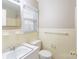 Bathroom featuring a sink, toilet, and a mirror at 5536 Seacroft Rd, Charlotte, NC 28210