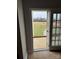 View of the large green backyard from the back door and small brick deck at 6795 Jones Rd, Salisbury, NC 28147