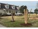 Well-maintained front yard and cozy one-story home with classic architecture and a white-railed porch at 6795 Jones Rd, Salisbury, NC 28147