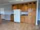 Kitchen boasts light wood cabinets, granite countertops, and stainless steel refrigerator at 6795 Jones Rd, Salisbury, NC 28147