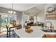 This breakfast nook flows into a living room with a fireplace and features backyard access via sliding glass doors at 7331 Sedgebrook W Dr, Stanley, NC 28164