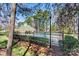 Community pool area surrounded by lush greenery and mature trees, offering a serene and refreshing recreational space at 7331 Sedgebrook W Dr, Stanley, NC 28164