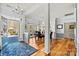 Light-filled dining area with hardwood floors, column accents, and views of the front yard at 7331 Sedgebrook W Dr, Stanley, NC 28164