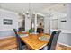 Bright dining room features a wooden table, chandelier, and hardwood floors at 7331 Sedgebrook W Dr, Stanley, NC 28164