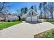Attractive home with a two-car garage and a wide driveway, nestled among mature trees at 7331 Sedgebrook W Dr, Stanley, NC 28164
