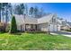 Charming home featuring a well-manicured lawn, stone accents, and a two-car garage at 7331 Sedgebrook W Dr, Stanley, NC 28164