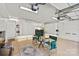 Large garage featuring white walls, cabinets, storage, and seating at 7331 Sedgebrook W Dr, Stanley, NC 28164