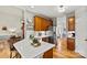 Spacious kitchen features a stainless steel fridge, wooden cabinets, white countertops, and modern decor at 7331 Sedgebrook W Dr, Stanley, NC 28164