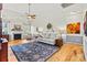 Comfortable living room featuring a fireplace, hardwood floors, and neutral décor at 7331 Sedgebrook W Dr, Stanley, NC 28164
