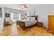 Cozy primary bedroom with natural light and wood floors at 7331 Sedgebrook W Dr, Stanley, NC 28164