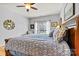 Spacious bedroom featuring a ceiling fan and patterned bedding at 7331 Sedgebrook W Dr, Stanley, NC 28164