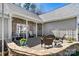Inviting front patio with stone accents, comfortable seating, and a beautifully landscaped area, creating a welcoming entrance at 7331 Sedgebrook W Dr, Stanley, NC 28164