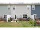 Cozy backyard patio with outdoor seating, a grill, and well-maintained lawn at 7456 Hartsfield Dr, Lancaster, SC 29720