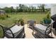 Inviting backyard with outdoor seating on a concrete patio, manicured lawn, and privacy fencing at 7456 Hartsfield Dr, Lancaster, SC 29720