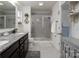 Bathroom featuring granite countertops, double vanity, tile floor, and glass shower at 7456 Hartsfield Dr, Lancaster, SC 29720
