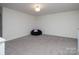Bright bonus room featuring neutral carpet, a beanbag chair, and ample natural light at 7456 Hartsfield Dr, Lancaster, SC 29720