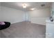 Large, light-filled bonus room with neutral carpet and plenty of space at 7456 Hartsfield Dr, Lancaster, SC 29720