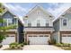 Charming two-story home with gray siding, stone accents, and a two-car garage at 7456 Hartsfield Dr, Lancaster, SC 29720