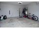 Spacious garage with ample storage racks, room for bikes, and extra space for projects or parking at 7456 Hartsfield Dr, Lancaster, SC 29720