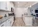 Bright kitchen with white cabinets, subway tile backsplash, and stainless steel appliances at 7456 Hartsfield Dr, Lancaster, SC 29720