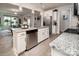 Well-lit kitchen featuring granite countertops, stainless appliances, and an open layout at 7456 Hartsfield Dr, Lancaster, SC 29720