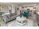Open-concept living space with views into the adjacent kitchen with an eat-in island at 7456 Hartsfield Dr, Lancaster, SC 29720